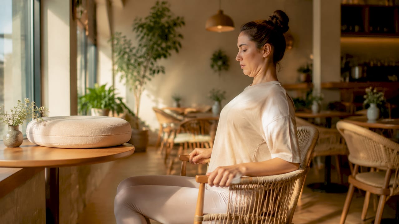 Mother performing neck posture exercise seated