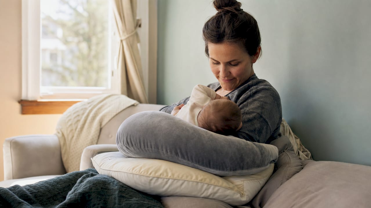 Overhead view of nursing pillow with cushions on lap