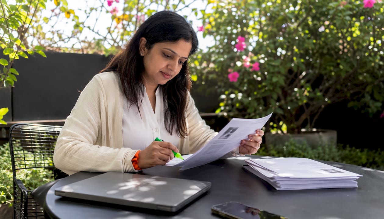 Recruiter reviewing candidate profiles in office