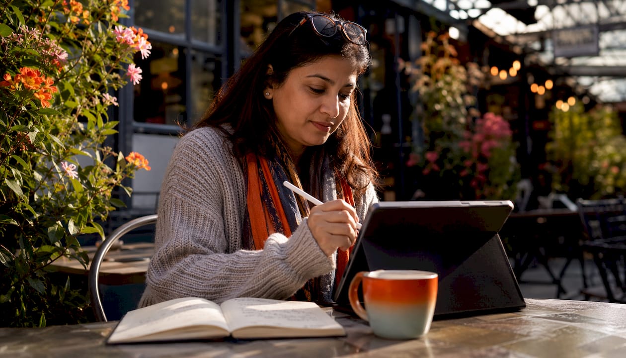 Small HR team member working on tablet at home office