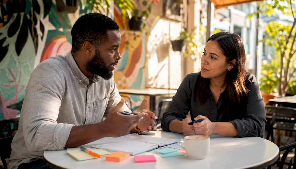 Two professionals discussing technical assessment roles