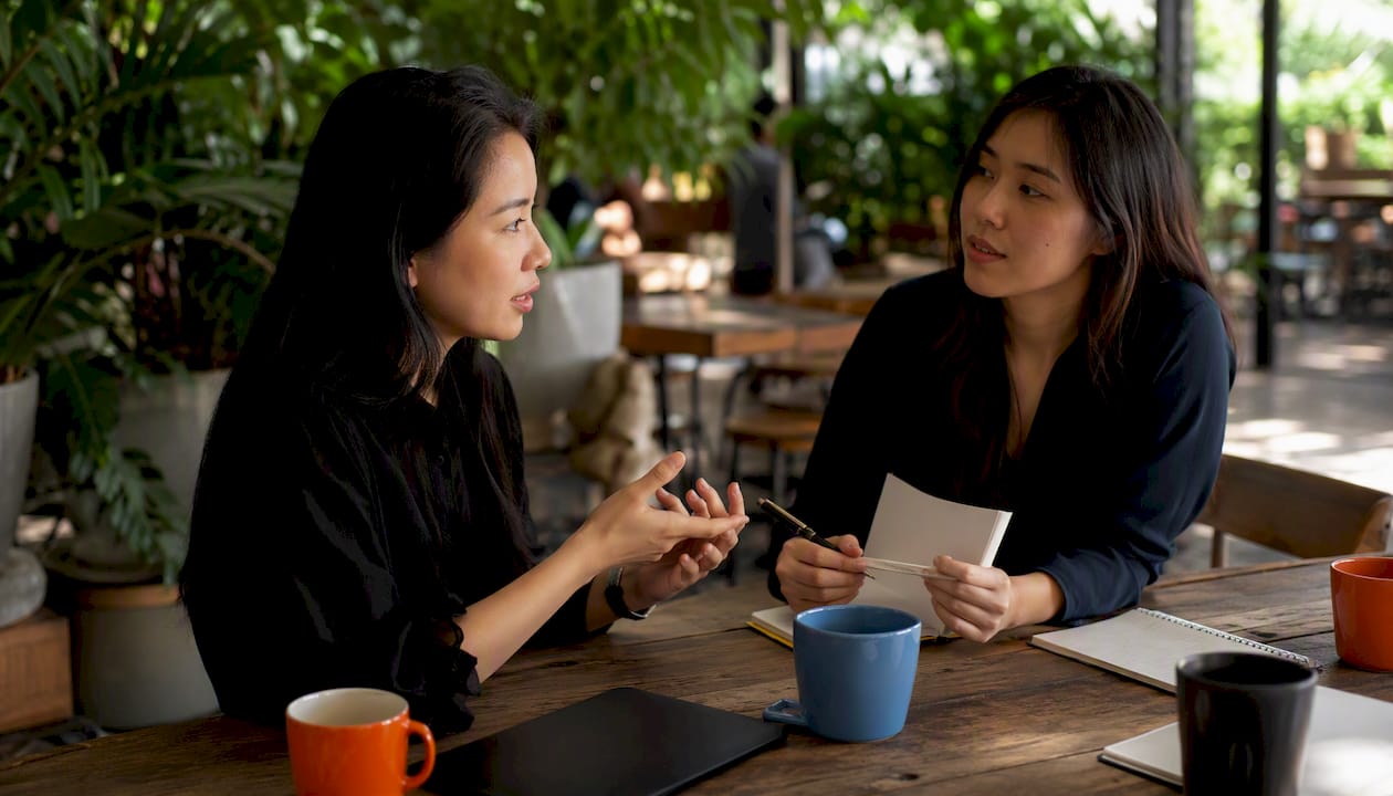 Recruiter collaborating on AI sourcing strategies