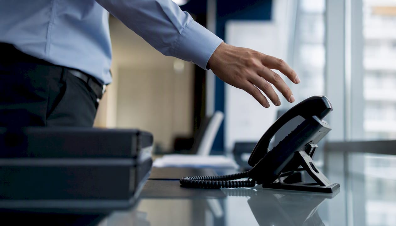 Hand dialing phone for compliance hotline