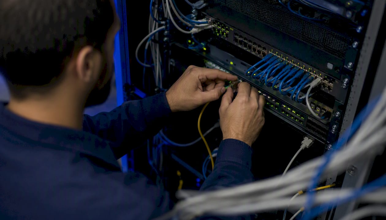 Hands configuring data infrastructure hardware