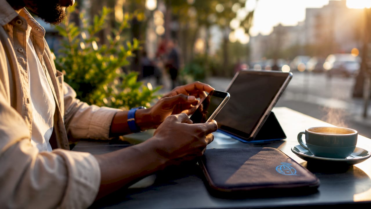 Hands installing eSIM via QR code outdoors