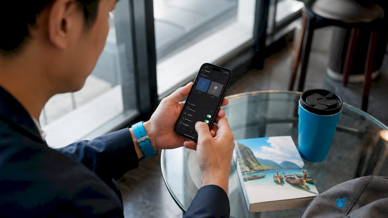 Hands holding smartphone with dual SIM settings