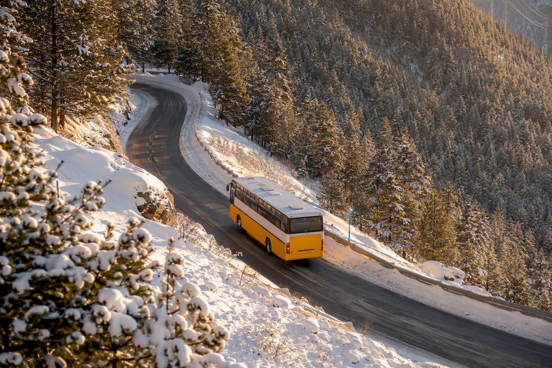 Winter transfer bus on mountain road