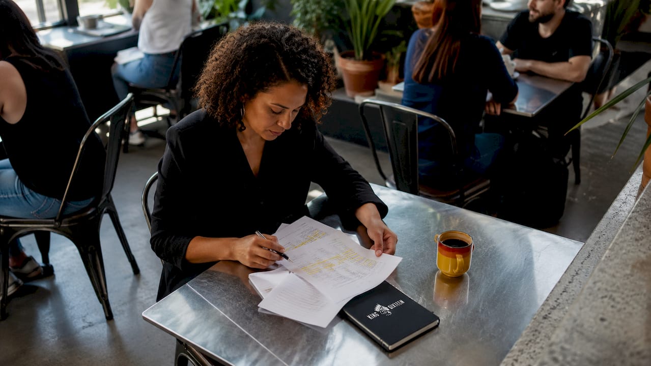 Woman reviewing event feedback forms