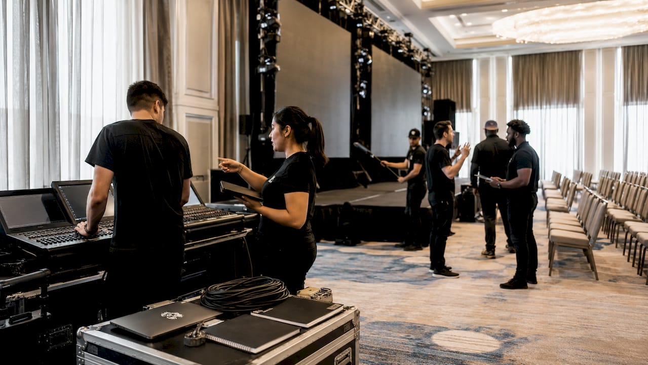 AV team setting up event stage