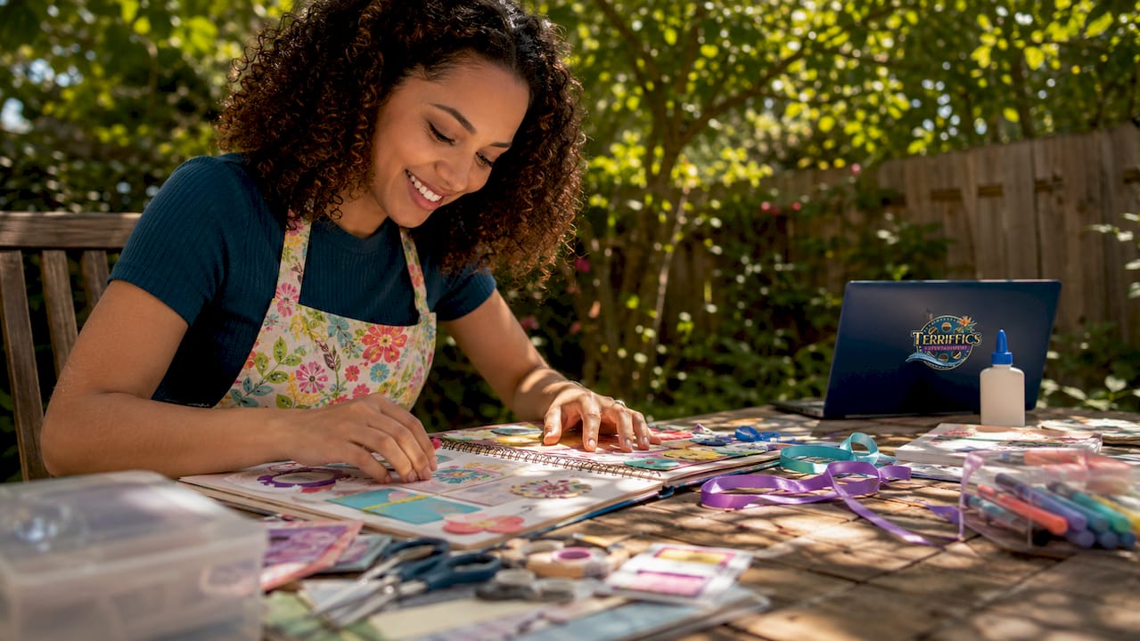 Young woman planning birthday party ideas at home