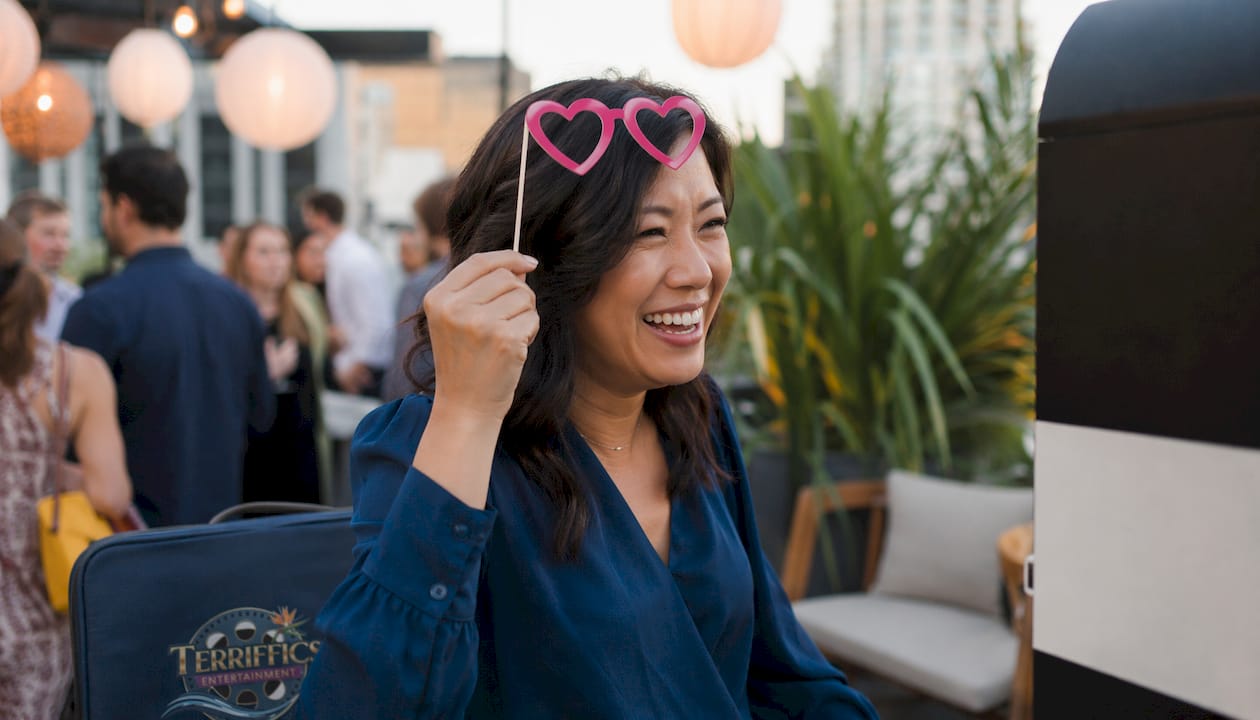 Woman at photo booth during corporate event