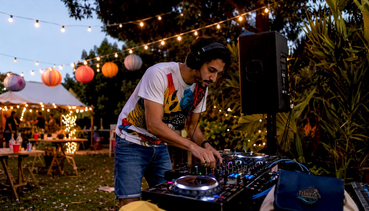 DJ setting up birthday party equipment