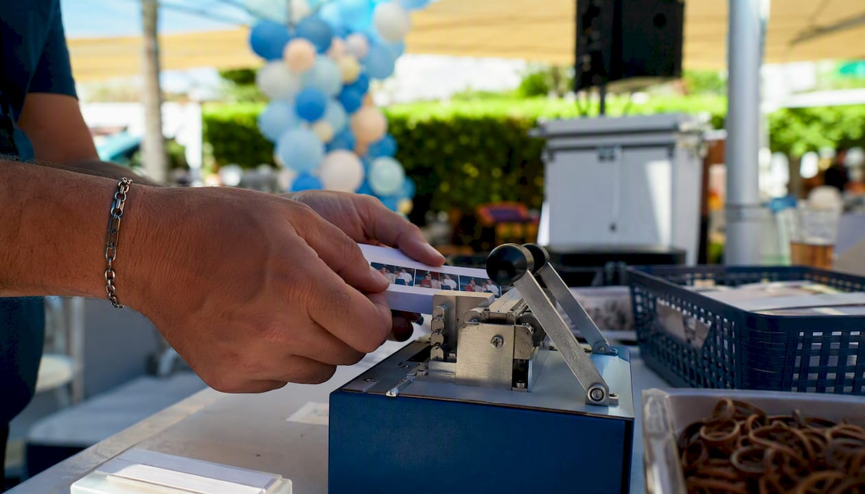 Hands binding flipbook pages at event