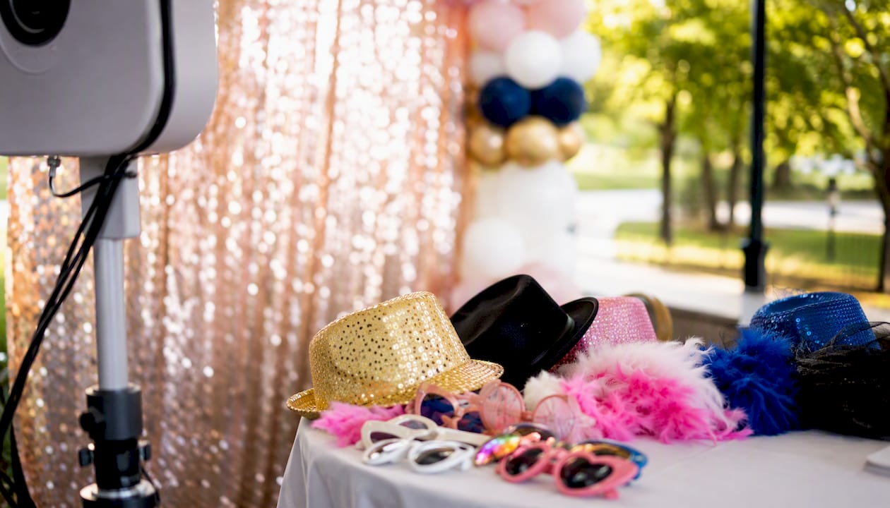 Photo booth setup with colorful backdrop and props