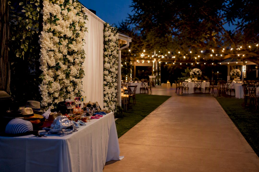 Well-placed wedding photo booth near bar and dance floor