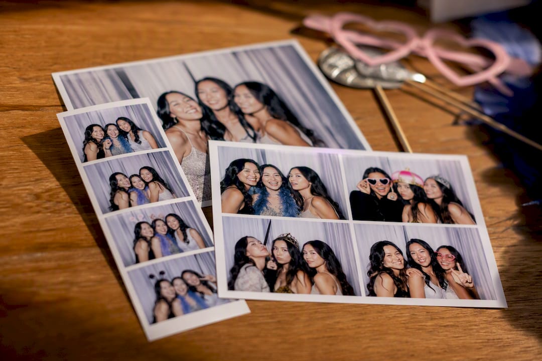 Assorted photo booth print sizes laid on table