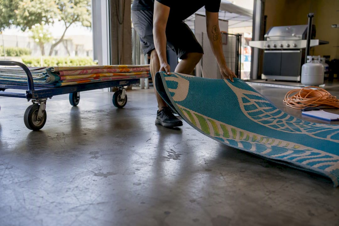 Loading dock setup with carpet runners and dolly