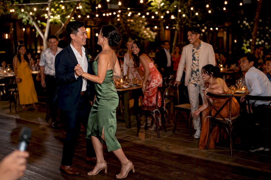 Guests begin dancing after wedding toast