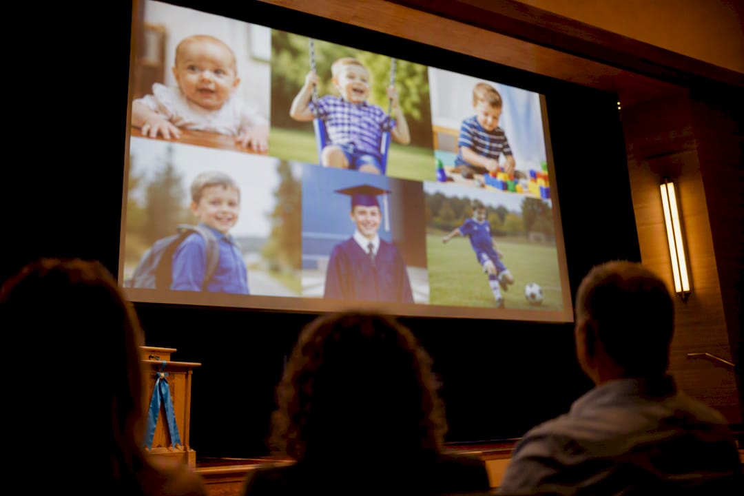 Graduation slideshow projected in auditorium