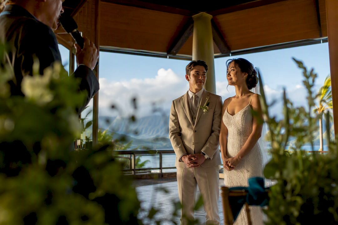Officiant speaking during wedding ceremony setup