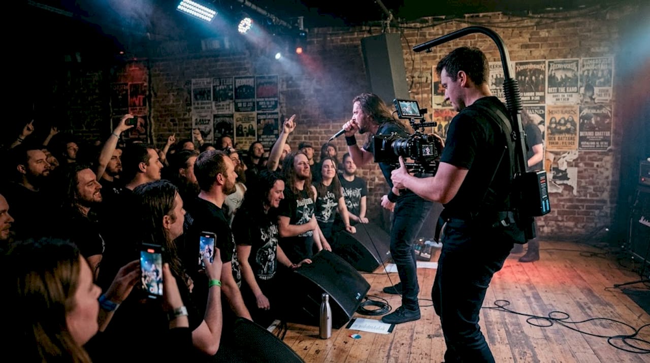 Metal band performing live with energetic crowd