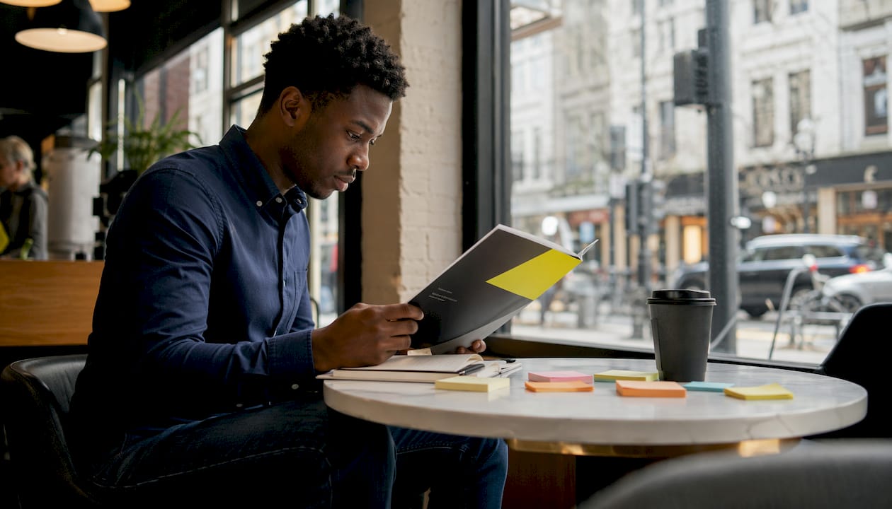 Man preparing company materials in coworking space