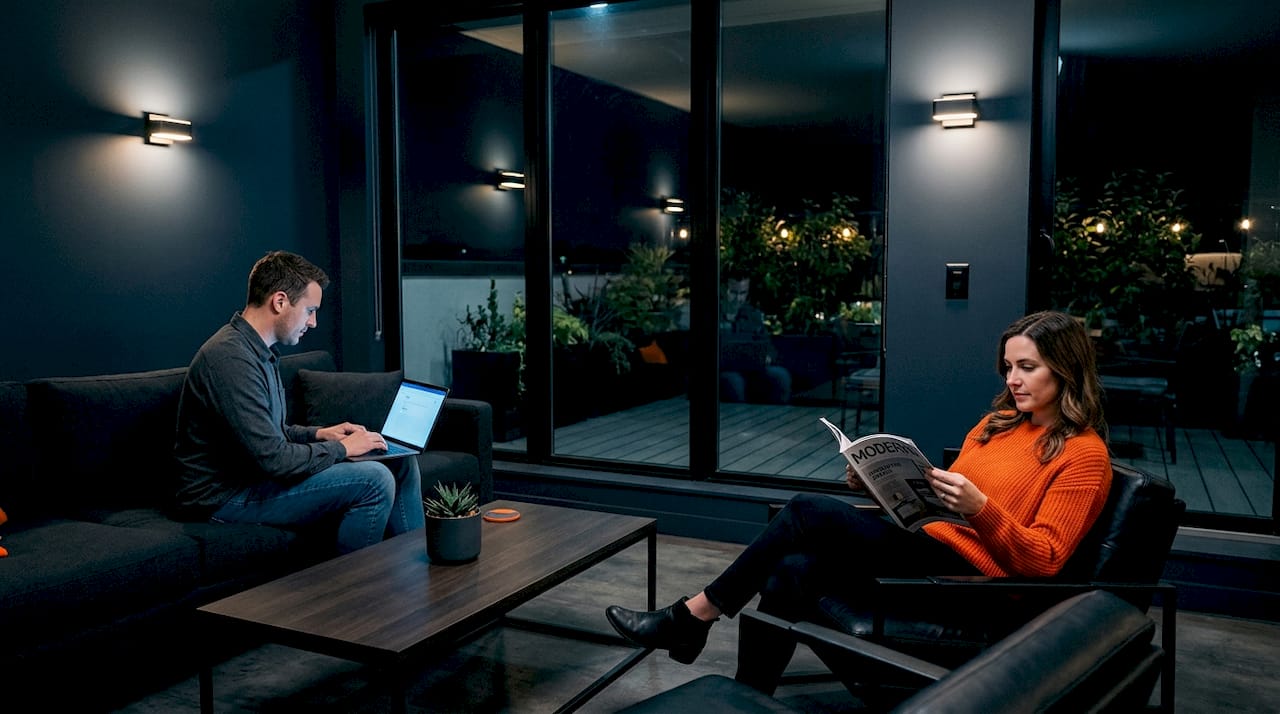 Couple relaxing under LED lighting in living room