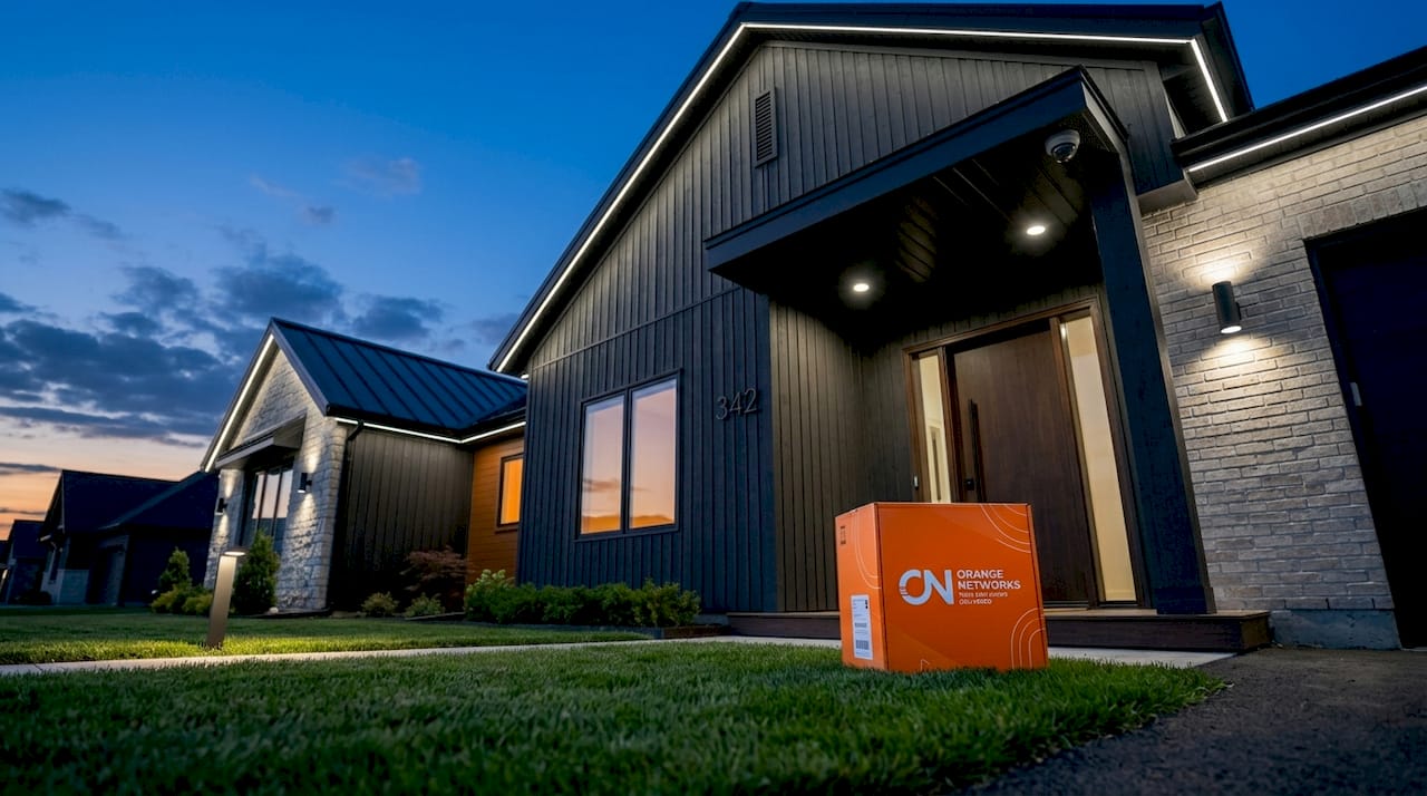 Suburban home with nighttime security lighting