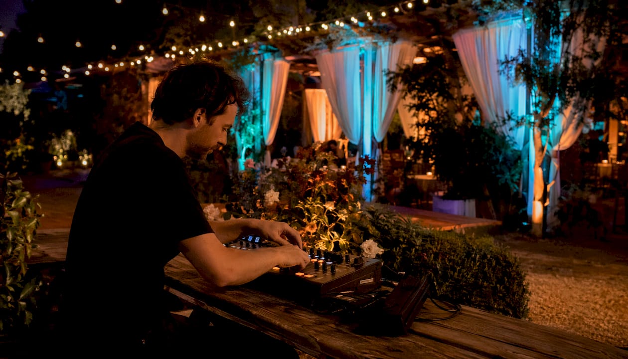 Technician adjusting uplighting at event venue