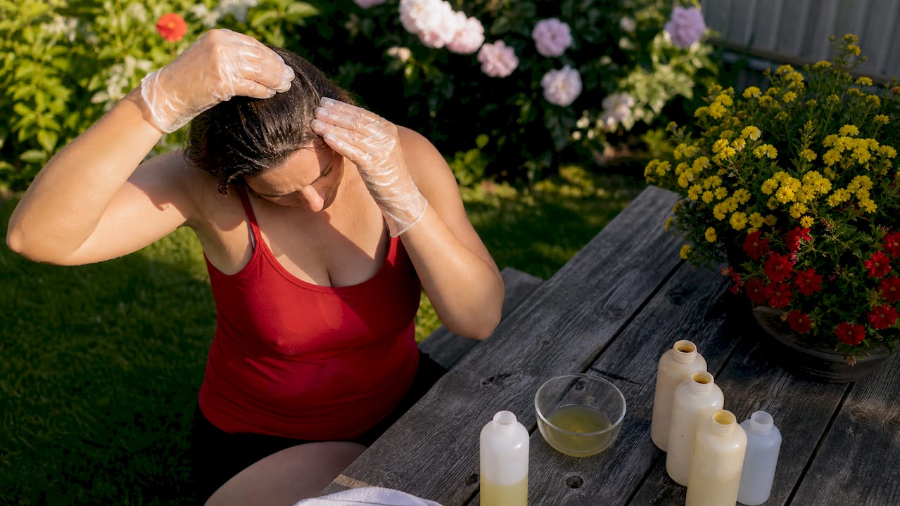 Hands performing Macujo Method hair wash