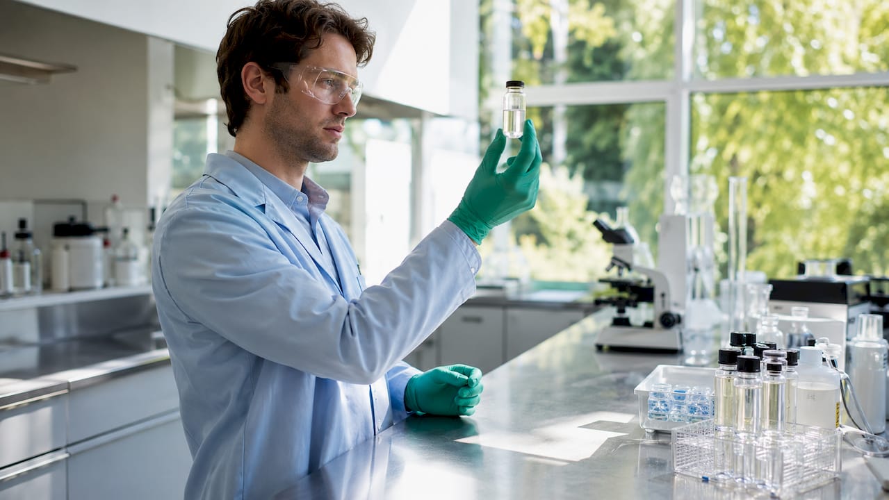 Lab technician analyzing detox shampoo sample