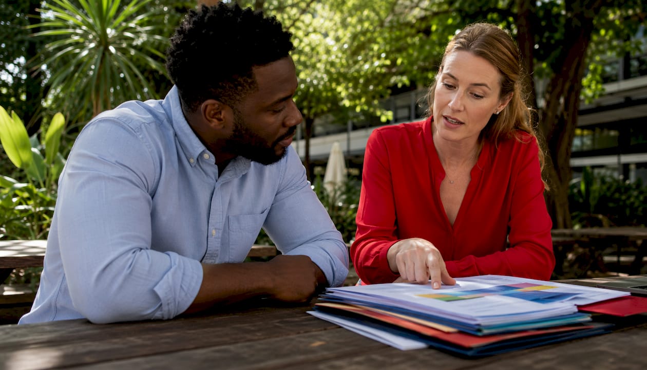 Two professionals discussing drug testing policies