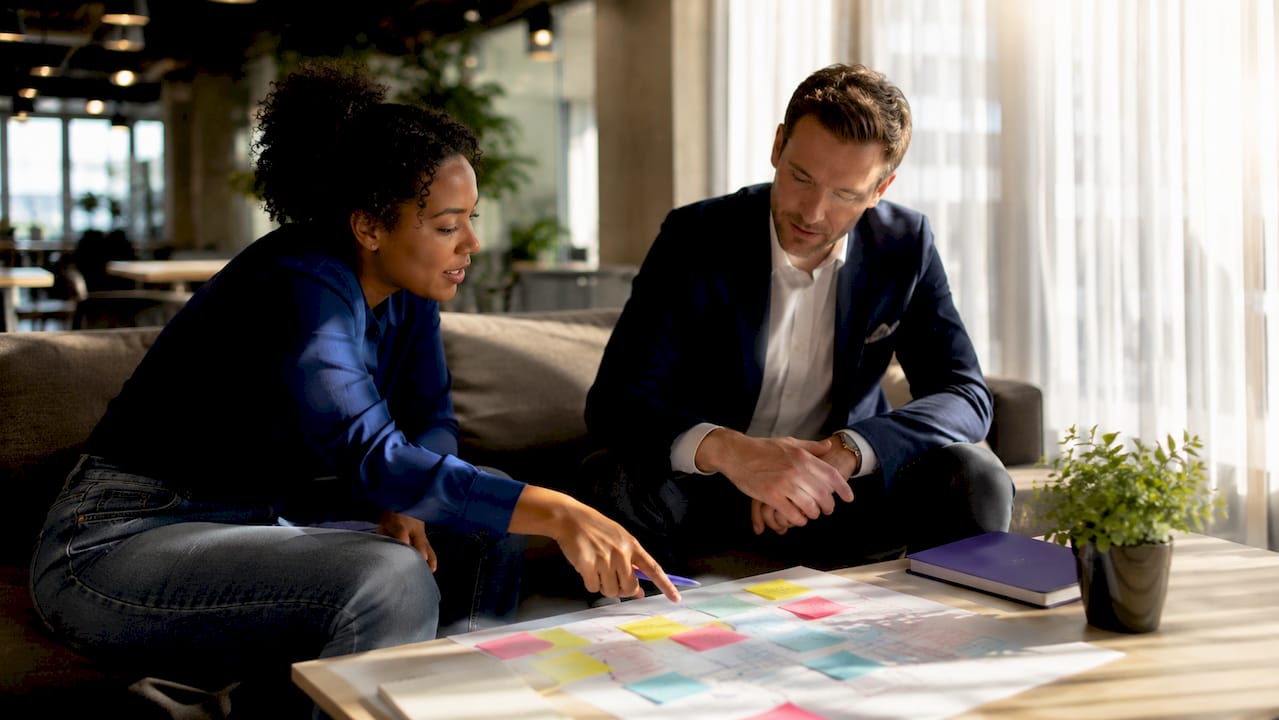 Two professionals discussing network segmentation types