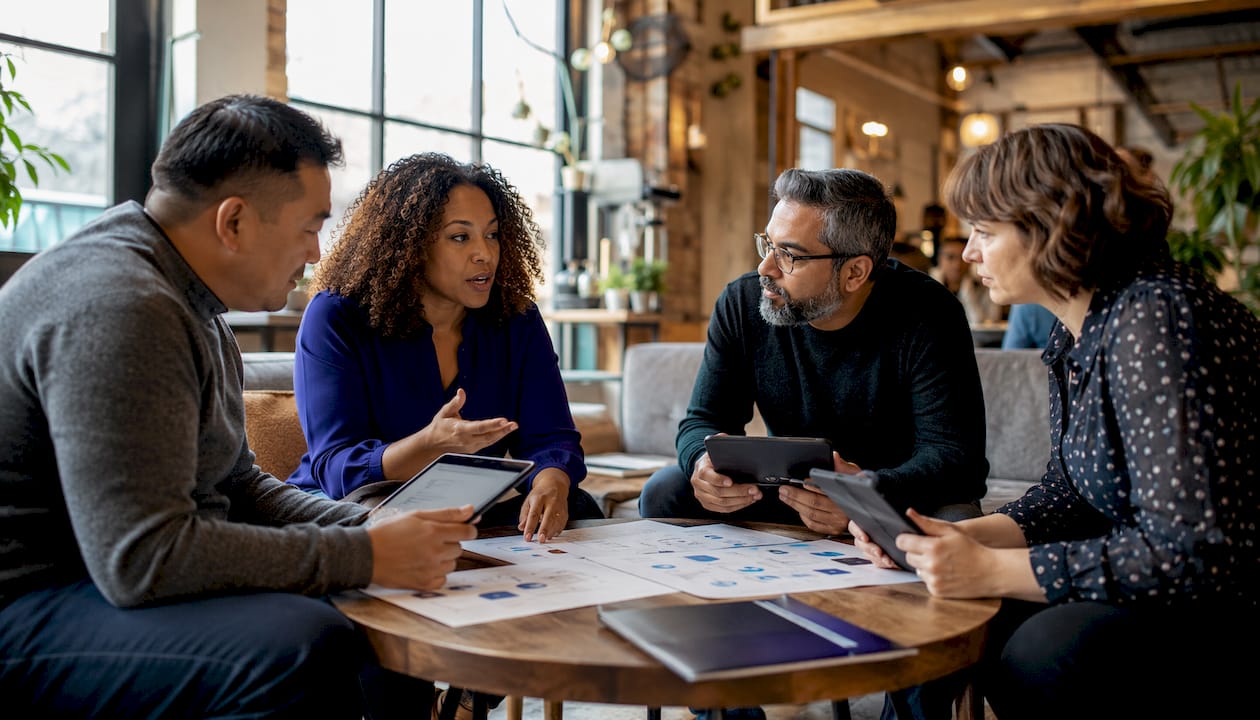 Regional IT support team collaborating in office