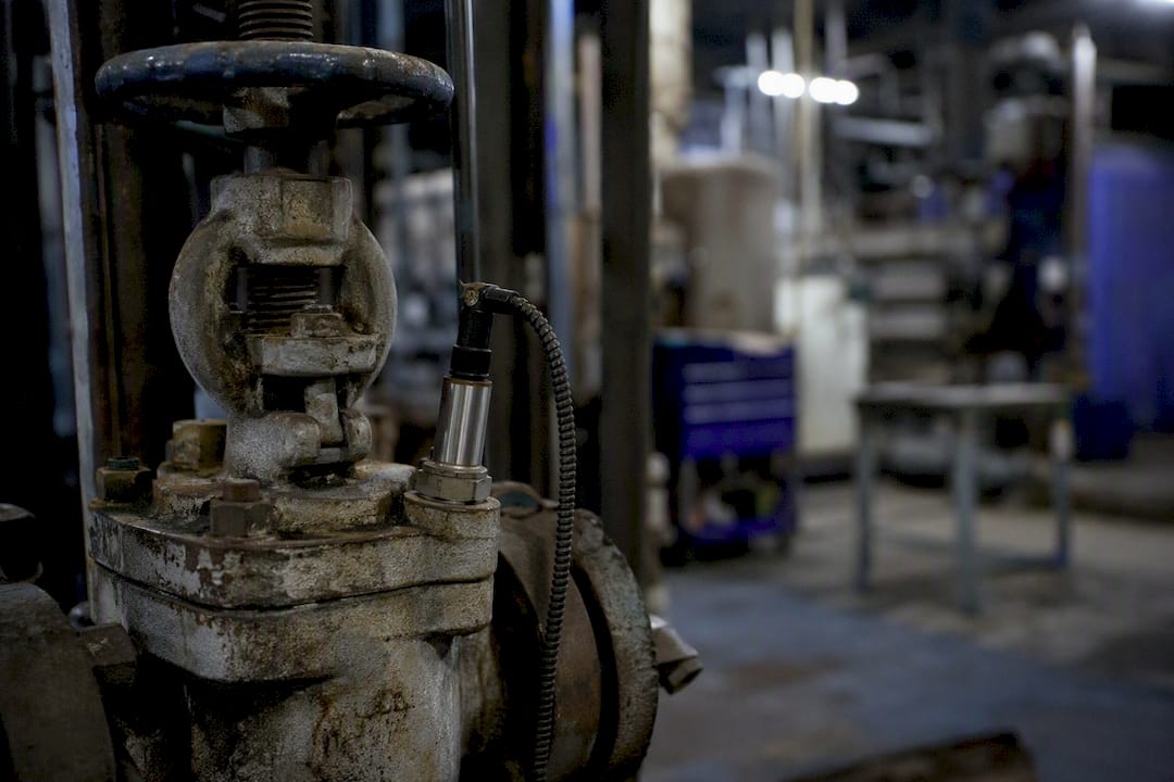Close-up of valve with sensor tag in factory