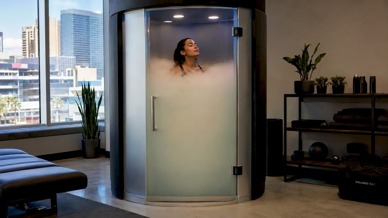 Athlete using cryotherapy chamber in luxury center