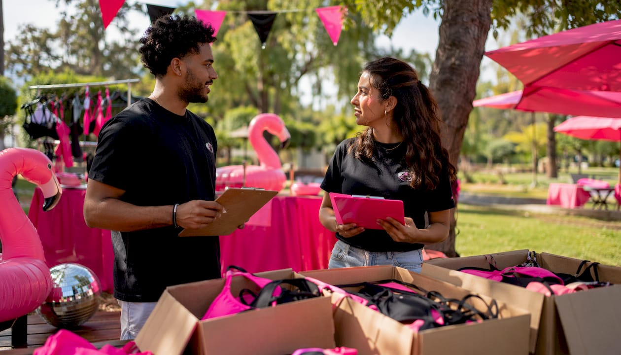 Event coordinators organizing swimwear inventory