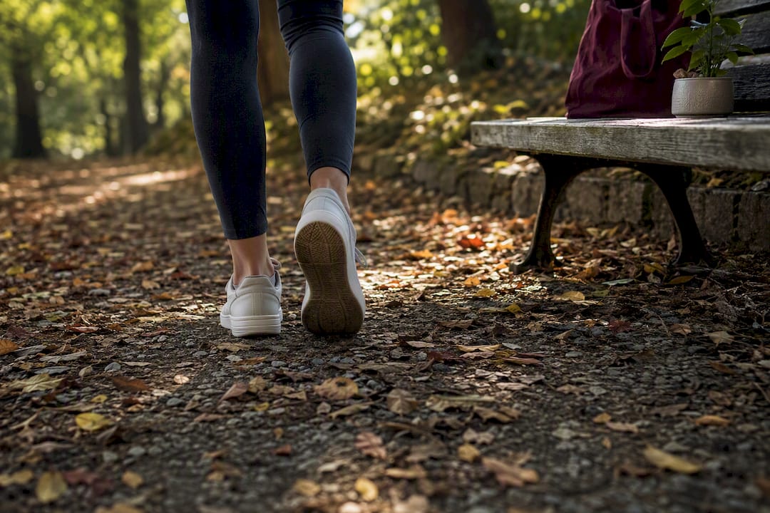Person walking in urban park path