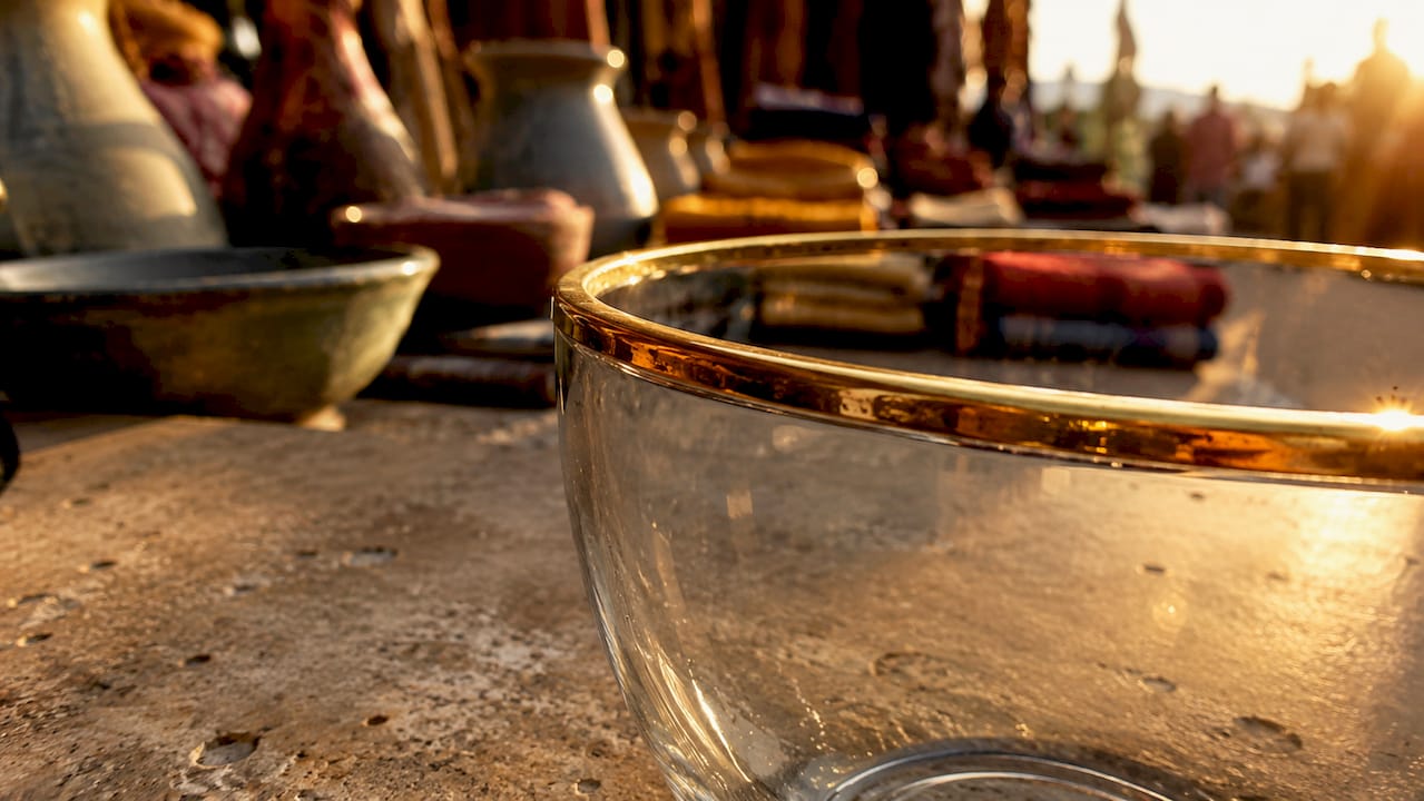 Close-up of gold-plated glass rim with visible plating layer