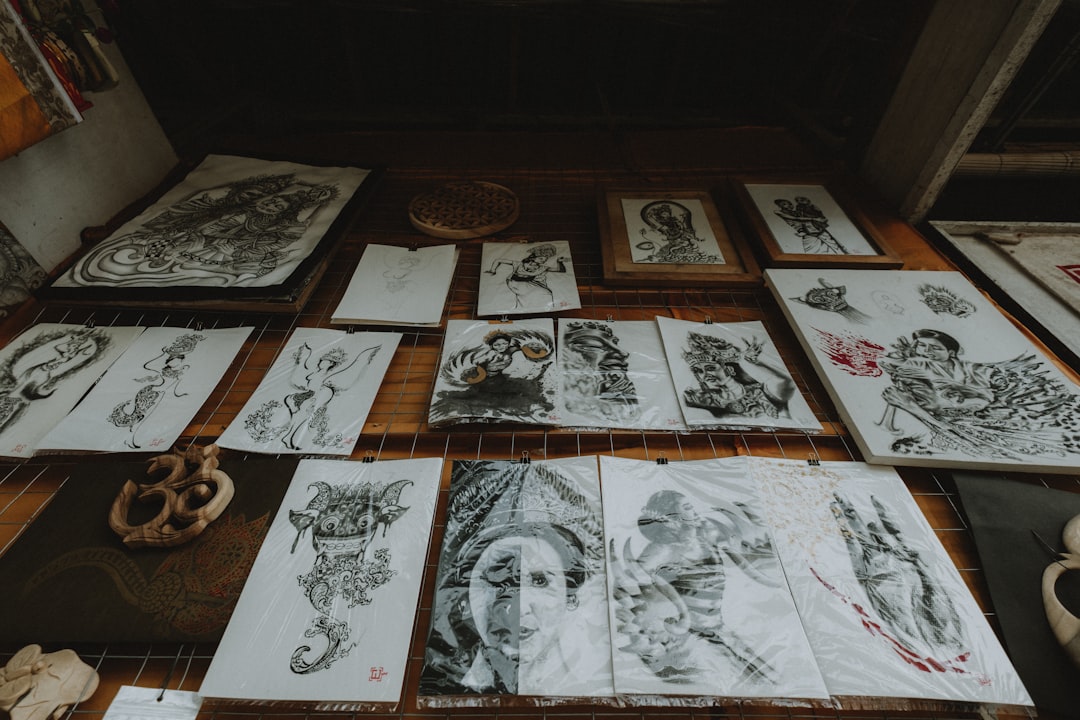 Tattoo artist sorting portfolio photos