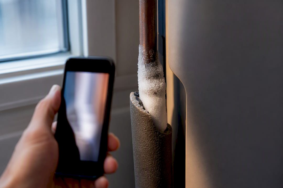 Frost forming on a heat pump line