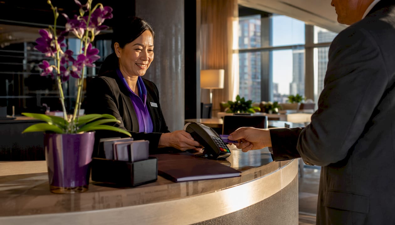 Hotel receptionist processing EMV chip card