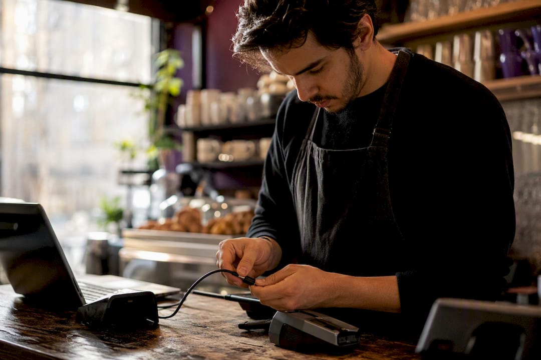 Employee wiring payment terminal cable