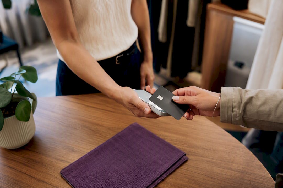 Card tapping a phone for contactless payment