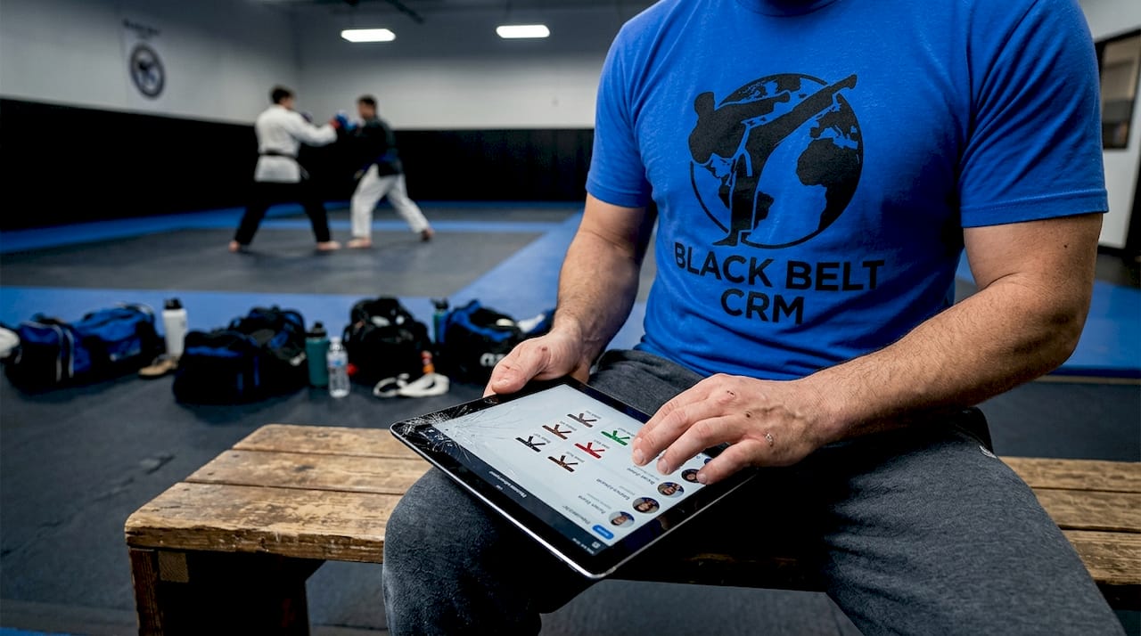 Coach tracking members' belt progression on tablet