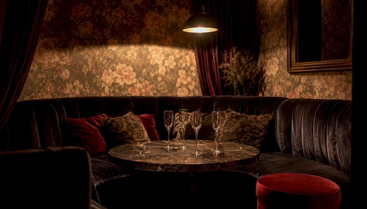 Empty VIP champagne room with intimate lighting