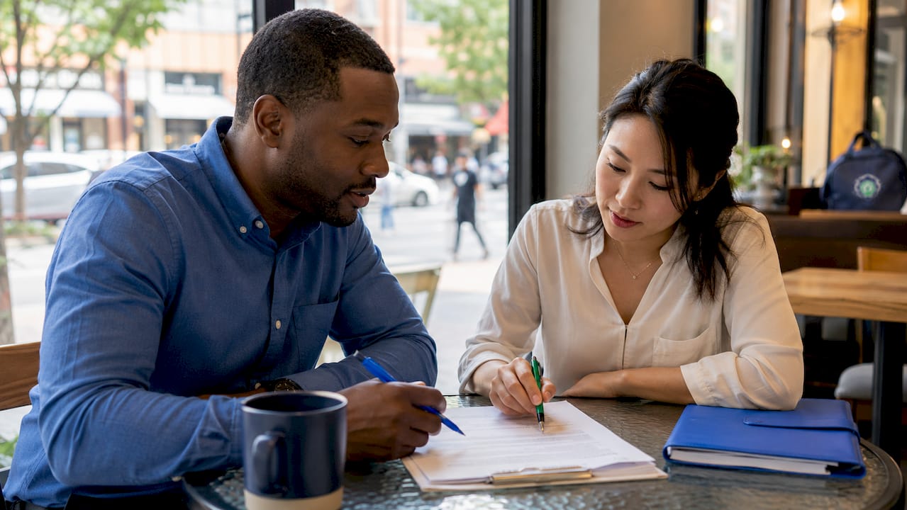 Facility managers discussing cleaning contract terms