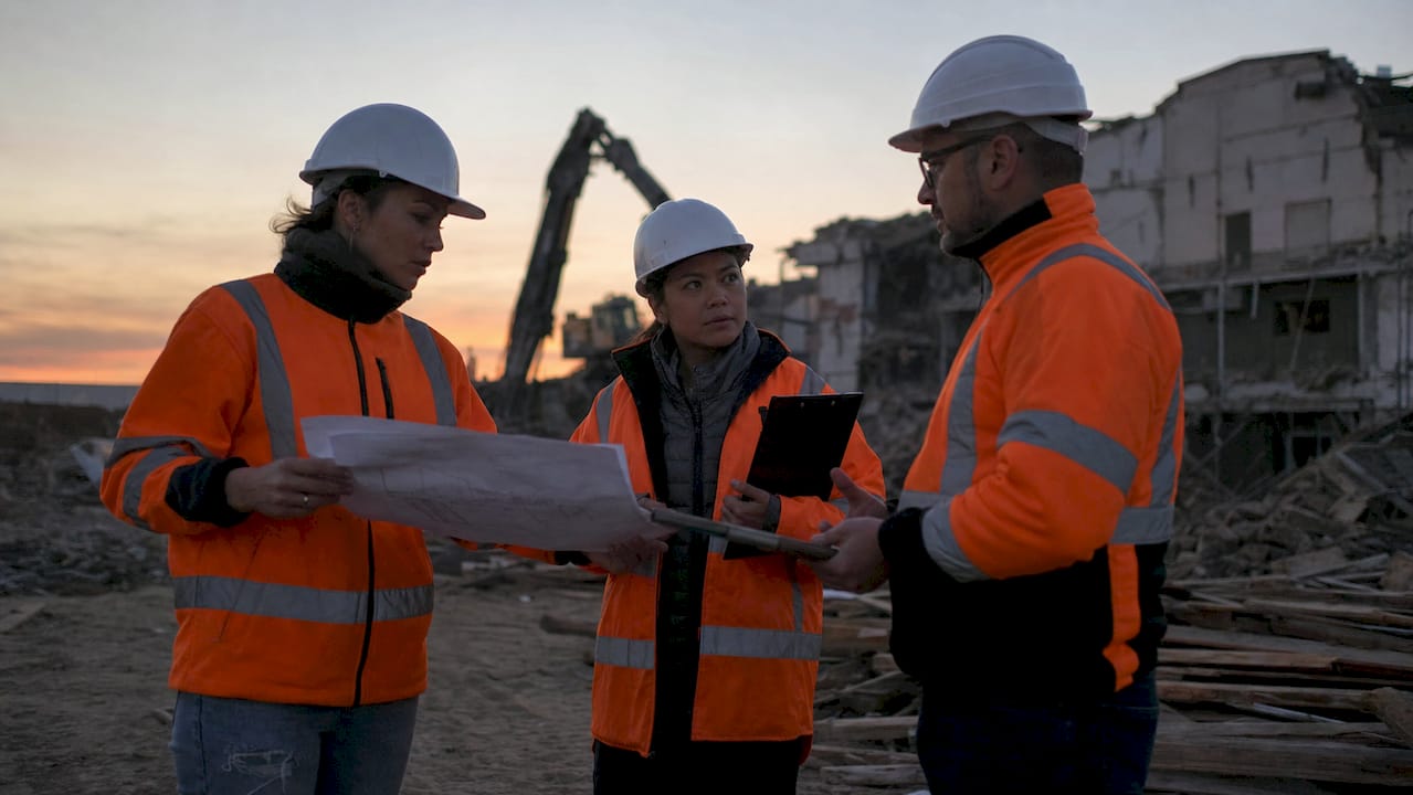 Team discussing demolition site risk management