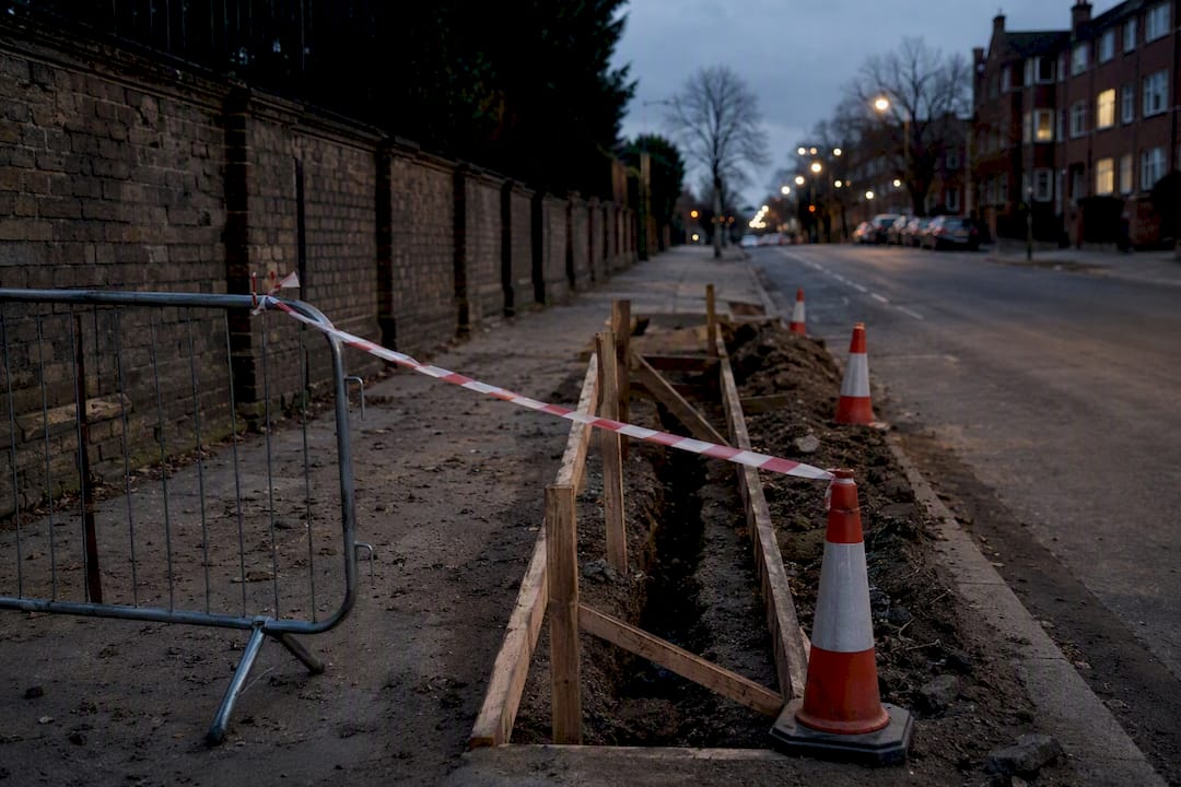 Unauthorised street works with warning tape and trench
