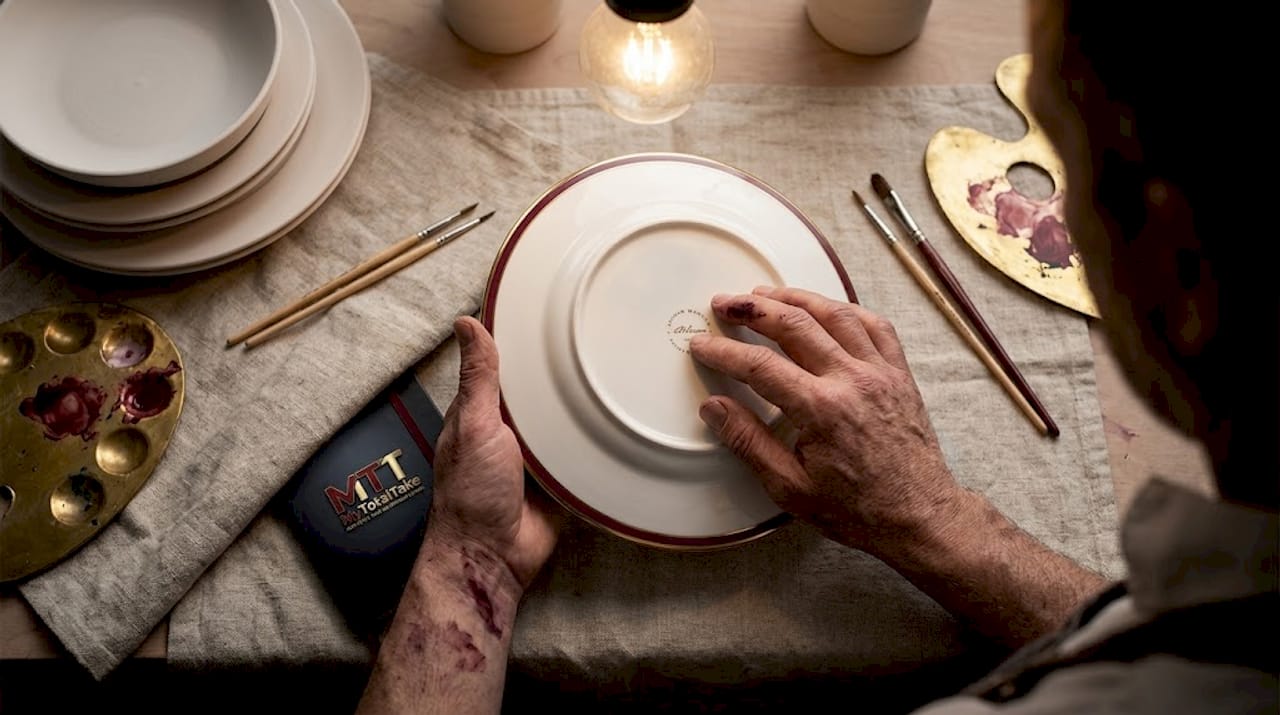 Artisan inspecting bone china tableware